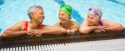 three older women in a swimming pool