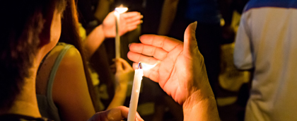 people holding candles at a peaceful protest