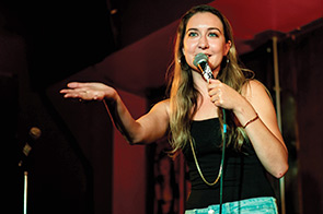 Kaitlin Nichols onstage speaking into a microphone