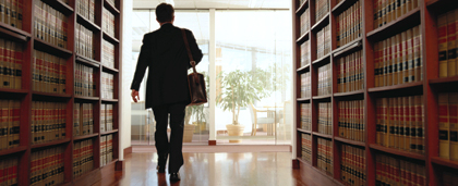 man walking through legal library