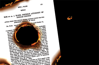 page of Roe v Wade decision burning