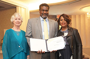NASW CEO Angelo McClain, center, accepts his induction into the NASW Social WorkPioneers® program with Betsy Vourlekis, left, chairperson of the NASW Pioneer SteeringCommittee, and NASW President Mildred “Mit” Joyner.