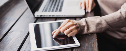 woman reading on tablet