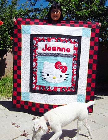 Lai with her Hello Kitty quilt and a dog