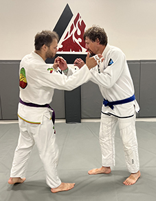 Jesse Johns, left, and Ryan Tolman begin a round at Bellingham BJJ in Bellingham, Wash., on Aug. 17, 2023