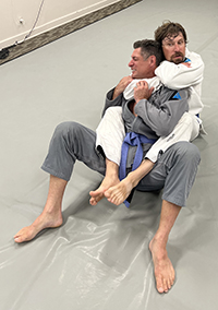 Tolman applies a chokehold during practice with Joe Carpenter at Bellingham BJJ in Bellingham, Wash., on Aug. 17