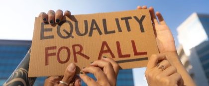 sign being held saying equality for all