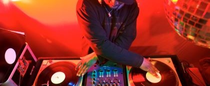 person mixing on turntables