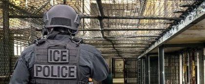 ICE officer walking through facility