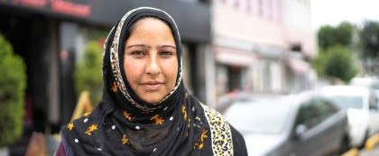 woman in headcovering looking at camera