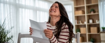 woman happy with letter