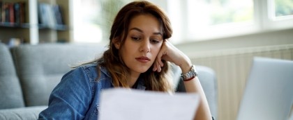 woman looking at bill