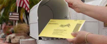 person mailing a ballot