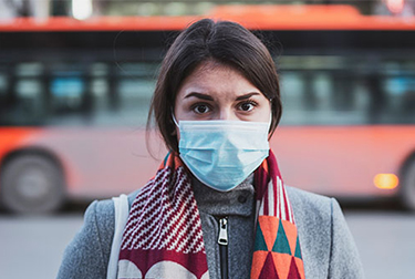woman on the street with protective face mask
