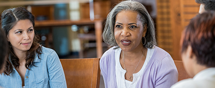 adults in a small group discussion