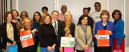 small group of NASW staff members standing together smiling