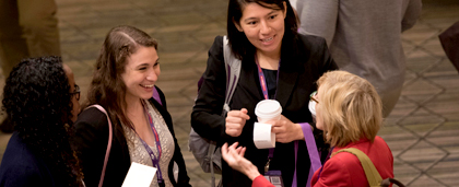 members chatting at an NASW conference