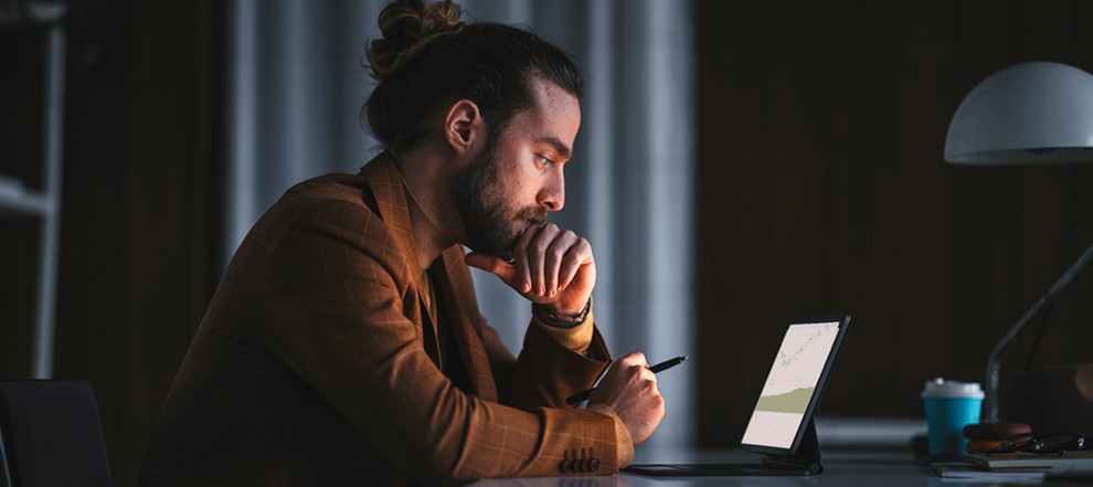 Man looking at tablet