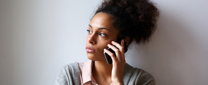 worried woman on cell phone