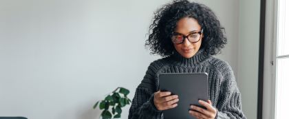 woman reading on a mobile device