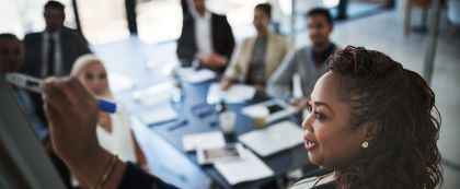 woman presenting to a group of people