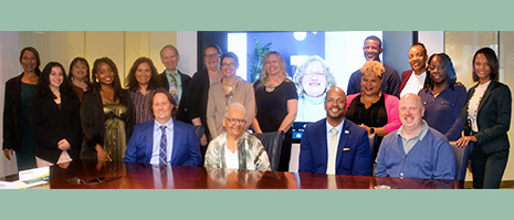 board members standing in a row