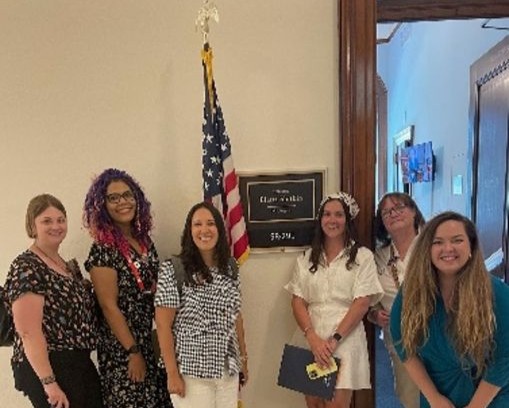 small group of NASW members outside of a congressional door