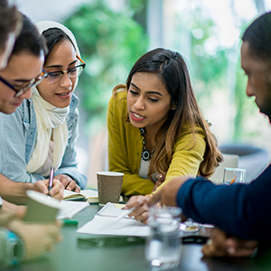 group of adults collaborating at a table