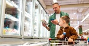 Man and son grocery shopping