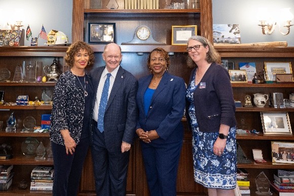 Members with Sen. Chris Coons (DE-D)