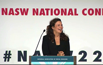 Sarah Butts at the podium at the 2022 NASW National Conference