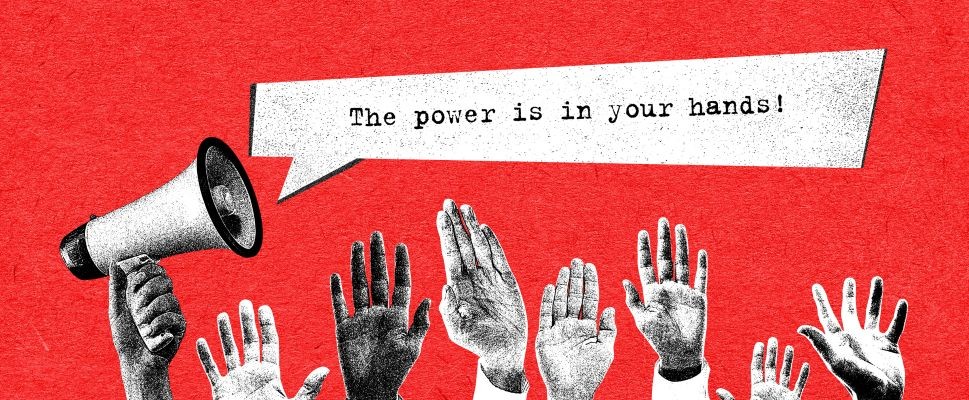 The Power is in Your hands with hands raised by megaphone