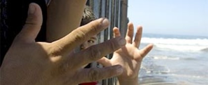 child hand, adult hand, fence, ocean