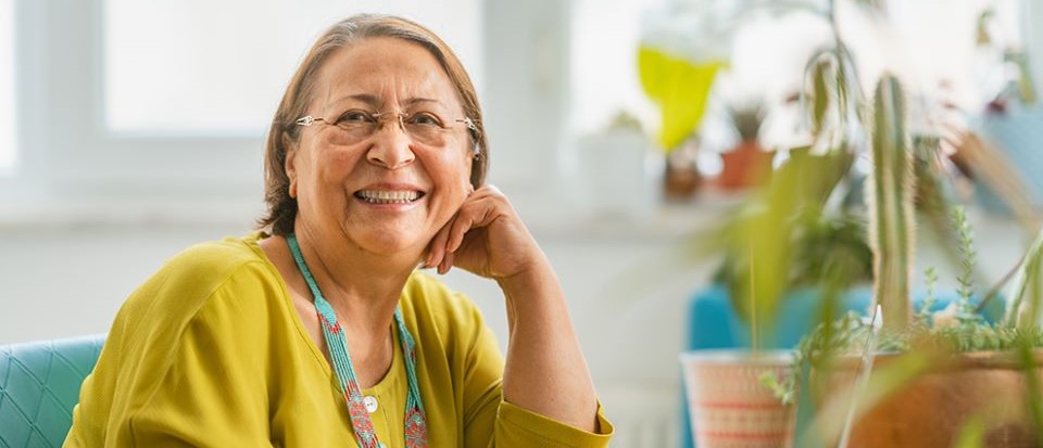 woman looking at the camera with head on hand