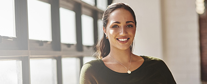 smiling woman in sunny windowsill