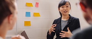 young professional speaking with colleagues