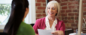 interviewer and job seeker sit at desk