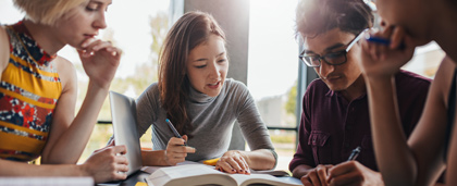 students studying in a group at a table