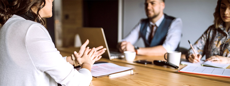 three people at a job interview