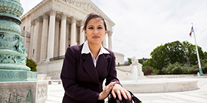 woman stands in front of U.S. Congress building