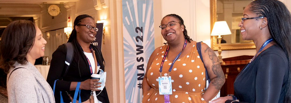 four black women chat at the NASW 2022 national conference