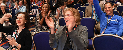 conference attendees cheering