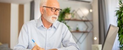 man looking at laptop and typing