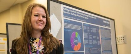 woman standing in front of her research