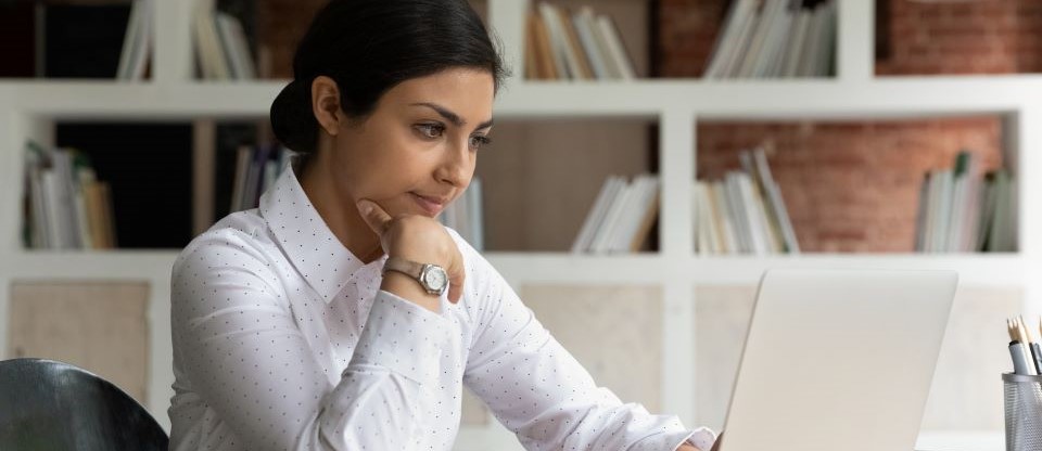 woman looking at laptop