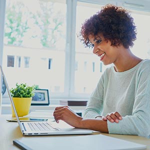 smiling woman working in a home office