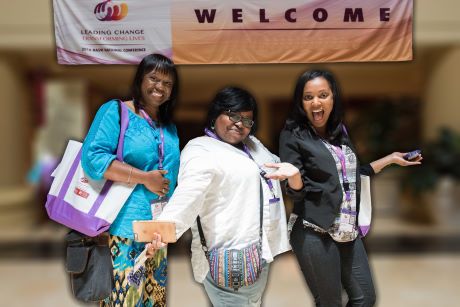 3 women in front of NASW conference