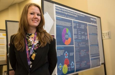 woman standing in front of research