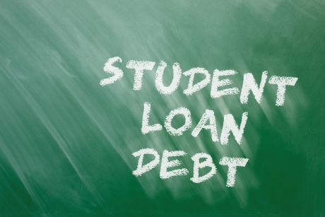 white board on which is written student loan debt