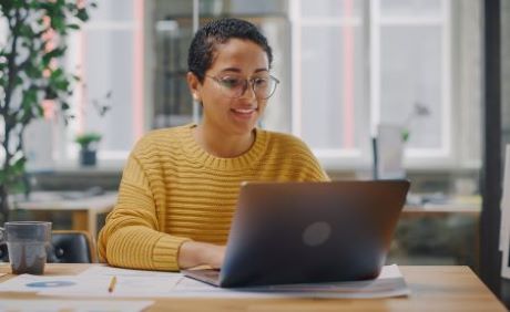 woman looking at laptop